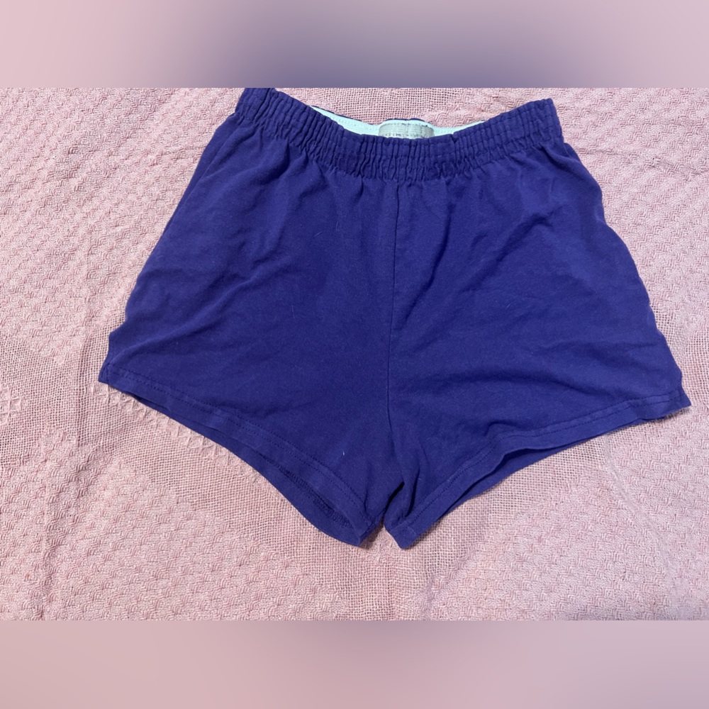 purple shorts.